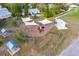 Aerial shot shows a park with playground, picnic tables, shade sails, and walking path at 2972 Lake Saxon Dr, Land O Lakes, FL 34639