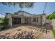 View of the exterior featuring gated front yard, complemented by mature landscaping and a paved yard at 3212 W Arch St, Tampa, FL 33607