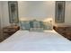 A bright bedroom featuring a comfortable bed with stylish decor and matching nightstands at 5215 Coquina Key Se Dr # A, St Petersburg, FL 33705