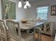 Inviting dining area with seating for six, featuring a large window at 5215 Coquina Key Se Dr # A, St Petersburg, FL 33705