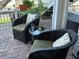 Enjoy the outdoors in this cozy patio seating area with chairs and a table at 5215 Coquina Key Se Dr # A, St Petersburg, FL 33705