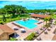 Aerial view of the community pool and lounge area, offering a perfect spot for relaxation and recreation at 3464 Sutherland Dr, Palm Harbor, FL 34684