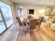 Cozy dining room featuring a wood table, gray chairs, and sliding glass doors to the outdoor patio at 3464 Sutherland Dr, Palm Harbor, FL 34684