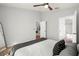 Bright bedroom with neutral walls, a ceiling fan, and adjoining bathroom and kitchen views at 7001 Interbay Blvd # 313, Tampa, FL 33616