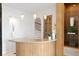 Bar area featuring custom cabinetry, granite countertop, and decorative lighting at 11710 N Armenia Ave, Tampa, FL 33612