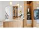 Bar area featuring custom cabinetry, granite countertop, and pendant lighting at 11710 N Armenia Ave, Tampa, FL 33612