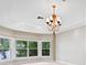 A bedroom boasts large windows providing natural light and views of a lake nearby at 11710 N Armenia Ave, Tampa, FL 33612