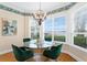 Cozy breakfast nook featuring a glass table and ample natural light from the bay window at 11710 N Armenia Ave, Tampa, FL 33612