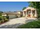 Elegant home exterior with a circular driveway, manicured landscaping, and a grand entrance at 11710 N Armenia Ave, Tampa, FL 33612