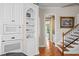 Bright kitchen area with built-in appliances and staircase access at 11710 N Armenia Ave, Tampa, FL 33612