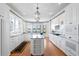 Spacious kitchen featuring custom white cabinetry and black granite countertops at 11710 N Armenia Ave, Tampa, FL 33612