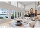 A stylish living room with high ceilings, marble floors, and lake views at 11710 N Armenia Ave, Tampa, FL 33612