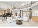 Expansive living room with soaring ceilings, marble floors, and elegant furnishings at 11710 N Armenia Ave, Tampa, FL 33612