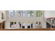 A second story loft overlooks a patio and yard with gorgeous views of the lake at 11710 N Armenia Ave, Tampa, FL 33612