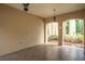 Covered outdoor patio with brick flooring leading to a beautifully landscaped garden at 11710 N Armenia Ave, Tampa, FL 33612
