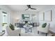 Cozy living area with neutral tones, modern artwork, and an open layout at 1600 Brandywine Way, Dunedin, FL 34698