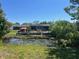 A beautiful backyard with a pond provides a serene oasis, perfect for relaxing and enjoying nature at 3332 Vorden St, New Port Richey, FL 34655
