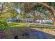 Well-maintained home featuring a lush front yard, covered parking, and inviting curb appeal at 5719 23Rd S Ave, Gulfport, FL 33707