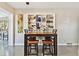 Bright dining area featuring a stylish table, seating for four, and a built-in display shelf at 4235 Moody St, St Pete Beach, FL 33706