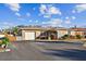 Charming single-story home featuring a two-car garage, manicured landscaping, and a well-maintained front yard at 4235 Moody St, St Pete Beach, FL 33706