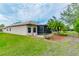 This home features a screened lanai and a beautifully landscaped backyard with a patio at 5004 Sandy Brook Cir, Wimauma, FL 33598