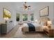 Serene bedroom retreat with a tray ceiling, neutral tones, and plenty of natural light at 5004 Sandy Brook Cir, Wimauma, FL 33598