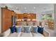Open-concept kitchen with stainless steel appliances, breakfast bar, and seamless flow to the living area at 5004 Sandy Brook Cir, Wimauma, FL 33598