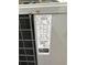 Close-up of air conditioner showing serial number and specifications at 51 Lexington Dr, Dunedin, FL 34698