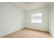 Bedroom featuring carpeting, a window, and closet at 51 Lexington Dr, Dunedin, FL 34698