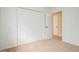 Bedroom featuring carpeting and large closet at 51 Lexington Dr, Dunedin, FL 34698