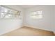 Bright bedroom with two large windows, inviting natural light at 51 Lexington Dr, Dunedin, FL 34698