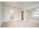 Bedroom with an ensuite bathroom and mirrored closet doors at 51 Lexington Dr, Dunedin, FL 34698
