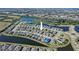An aerial view showcasing the layout of this beautiful Primary planned community surrounded by lush landscaping and serene lakes at 6232 Sea Air Dr, Apollo Beach, FL 33572