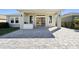 Paver patio with outdoor kitchen, sliding glass doors, and spacious design at 6232 Sea Air Dr, Apollo Beach, FL 33572
