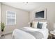 Serene bedroom with a queen-sized bed, natural lighting, and minimalist decor, creating a peaceful retreat at 6232 Sea Air Dr, Apollo Beach, FL 33572