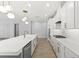 Spacious kitchen featuring a large island, quartz countertops, and modern appliances at 6232 Sea Air Dr, Apollo Beach, FL 33572