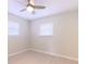 Bright bedroom features neutral walls, wood-look flooring and a ceiling fan at 6699 78Th N Ave, Pinellas Park, FL 33781
