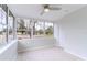 Sun room features many windows bringing natural light and a ceiling fan at 6699 78Th N Ave, Pinellas Park, FL 33781