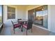 Covered patio with a table, four chairs, and sliding glass doors leading to the inside of the home at 10374 Echo Dock Loop, San Antonio, FL 33576