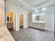 Spacious bathroom with modern gray vanity, walk in shower, and tray ceiling providing lots of natural light at 11199 Warm Wind Way, Weeki Wachee, FL 34613