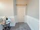 Hallway featuring stylish wainscoting, a door, and decorative elements at 11199 Warm Wind Way, Weeki Wachee, FL 34613