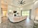 Spacious living room with high ceilings, tile flooring, a fireplace, and sliding doors to the outdoor patio at 11199 Warm Wind Way, Weeki Wachee, FL 34613