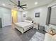 Spacious main bedroom with a modern ceiling fan and large bed providing a comfortable space at 11199 Warm Wind Way, Weeki Wachee, FL 34613