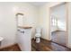 Comfortable half bathroom with a toilet, and an adjacent dressing room at 2201 Park N St, St Petersburg, FL 33710