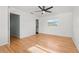 Bedroom featuring hardwood floors, white walls, and a ceiling fan at 6327 2Nd S Ave, St Petersburg, FL 33707