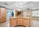 Kitchen island with a granite countertop, cabinetry, and an overhead light fixture at 6327 2Nd S Ave, St Petersburg, FL 33707