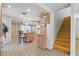 Open concept kitchen and dining space with an island and staircase at 6327 2Nd S Ave, St Petersburg, FL 33707