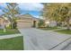 Charming single-story home with a well-maintained lawn and a two-car garage at 814 Fern Leaf Dr, Ruskin, FL 33570