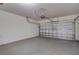 Spacious garage with concrete flooring, overhead door opener, and ample space for parking and storage at 814 Fern Leaf Dr, Ruskin, FL 33570