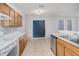The eat-in kitchen showcases tile flooring, wood cabinets, and stainless steel appliances at 814 Fern Leaf Dr, Ruskin, FL 33570